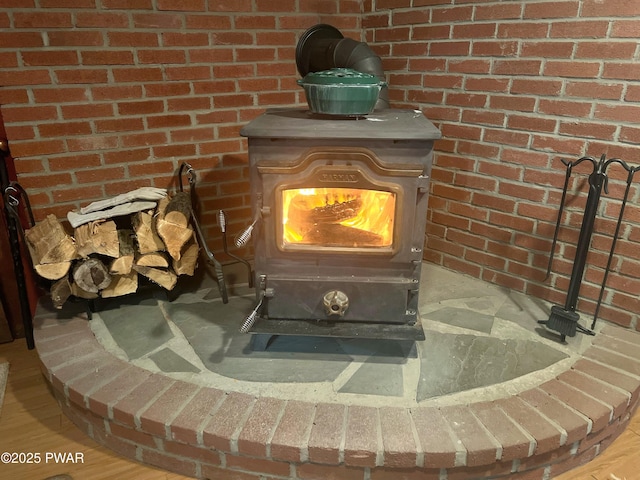 1304 Pratt Hollow Rd, Nicholson, PA 18446 - detailed view of a wood stove and brick wall