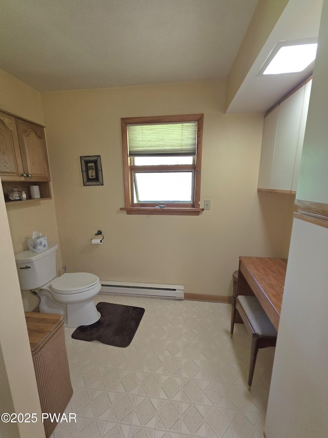 1304 Pratt Hollow Rd, Nicholson, PA 18446 - bathroom featuring baseboard heating, toilet, tile patterned floors, and baseboards