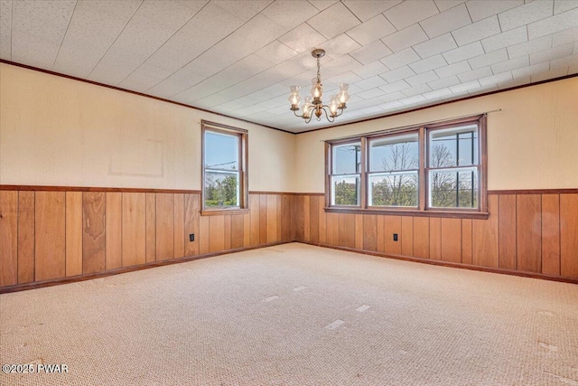 1409 Beach Lake Hwy, Beach Lake, PA 18405 - carpeted spare room with crown molding, wood walls, a wainscoted wall, and a chandelier