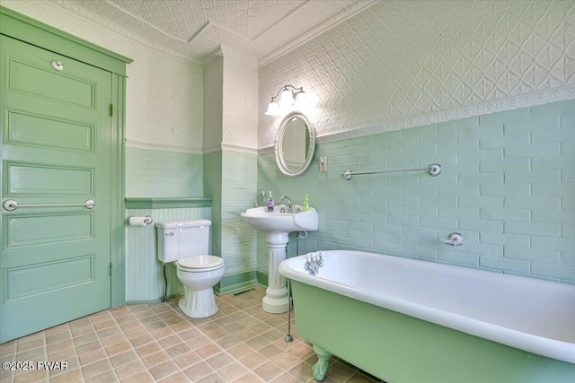 1409 Beach Lake Hwy, Beach Lake, PA 18405 - full bath with tile patterned floors, a soaking tub, and toilet