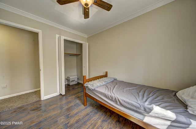235 Oak Hill Rd, Hawley, PA 18428 - bedroom featuring dark wood-style flooring, ceiling fan, baseboards, ornamental molding, and a closet