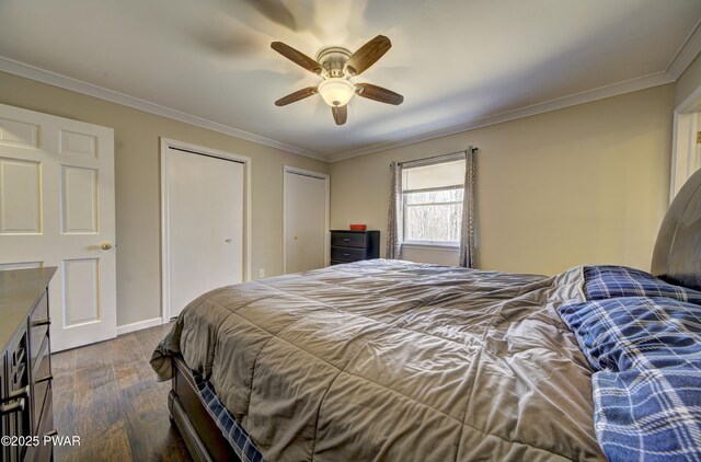 235 Oak Hill Rd, Hawley, PA 18428 - bedroom featuring ceiling fan, multiple closets, ornamental molding, baseboards, and dark wood-style floors