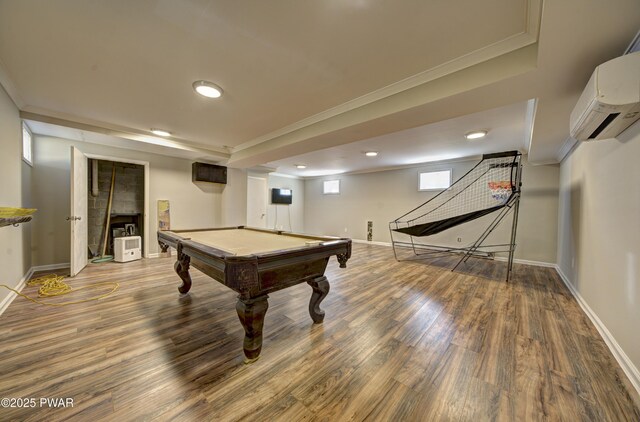 235 Oak Hill Rd, Hawley, PA 18428 - recreation room with crown molding, an AC wall unit, baseboards, and wood finished floors