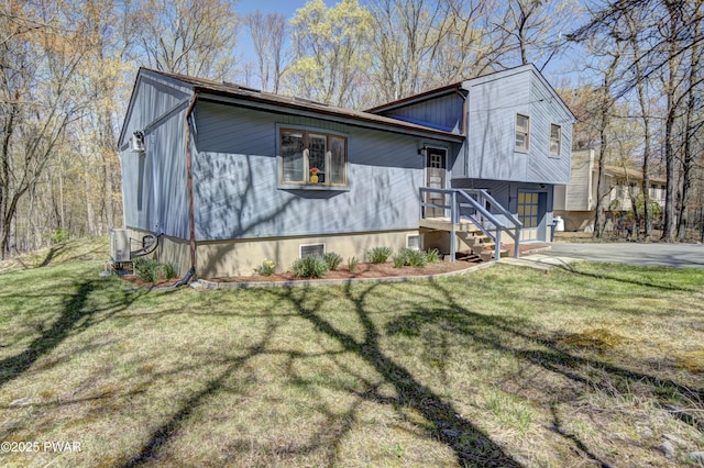235 Oak Hill Rd, Hawley, PA 18428 - view of side of home featuring a yard, an attached garage, and driveway