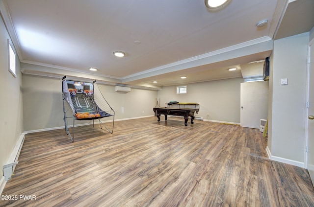 235 Oak Hill Rd, Hawley, PA 18428 - recreation room featuring crown molding, an AC wall unit, recessed lighting, baseboards, and wood finished floors