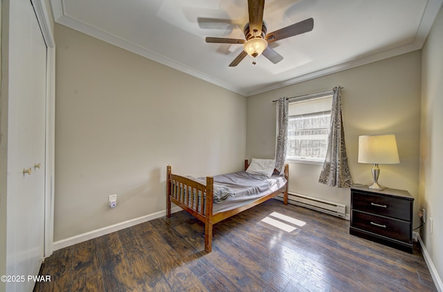 235 Oak Hill Rd, Hawley, PA 18428 - bedroom featuring crown molding, baseboards, wood finished floors, and a baseboard radiator