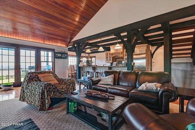 living room featuring high vaulted ceiling and wood ceiling