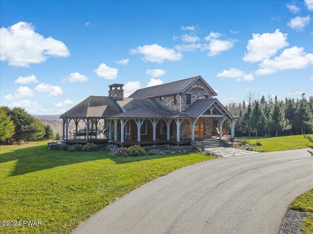 view of front of property with a front lawn and a porch