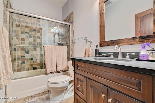 full bathroom featuring vanity, toilet, and enclosed tub / shower combo