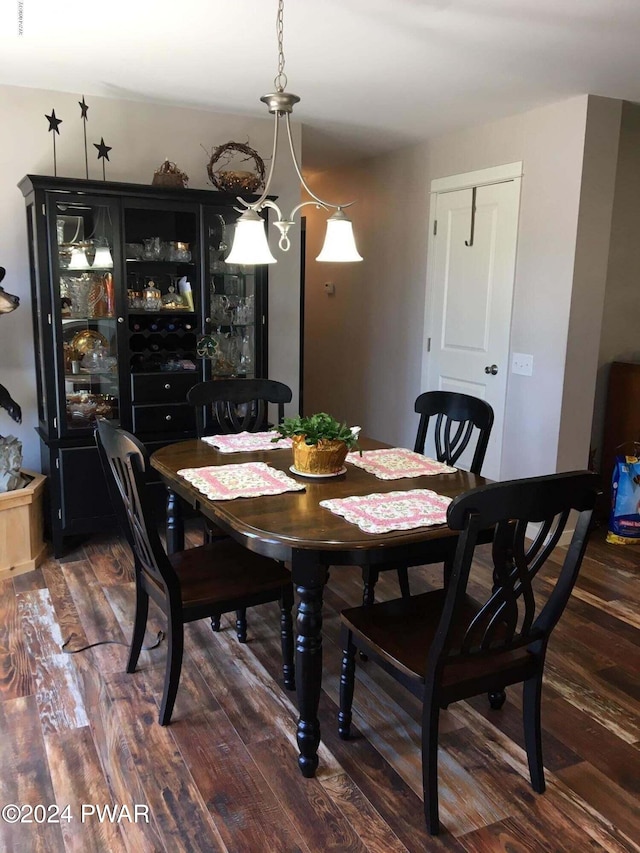 dining area with wood finished floors