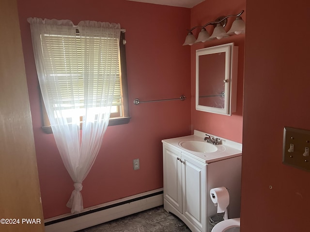 bathroom featuring a baseboard radiator, tile patterned flooring, and vanity