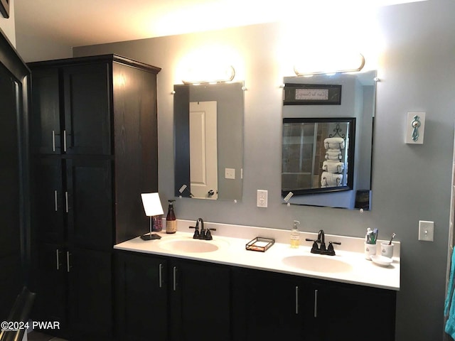 bathroom with double vanity and a sink