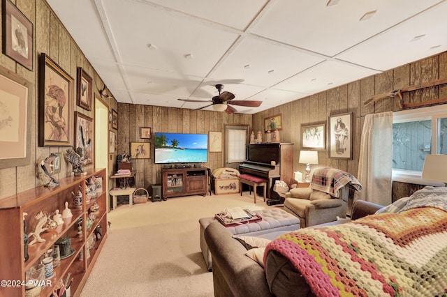 living room featuring ceiling fan and carpet floors