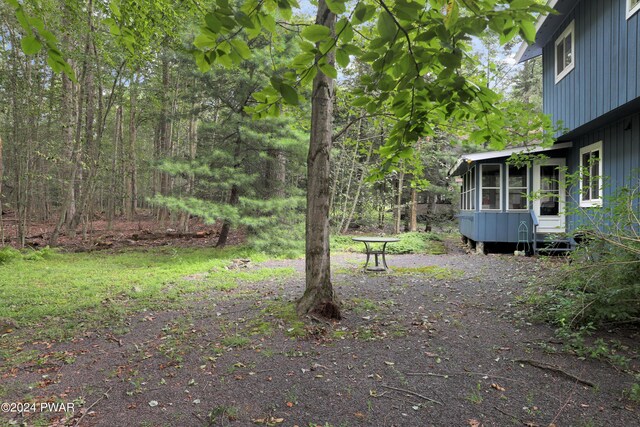 view of yard with a sunroom