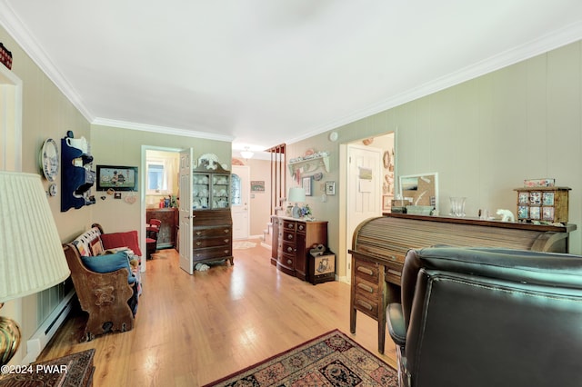 bedroom featuring a baseboard radiator, light hardwood / wood-style flooring, and ornamental molding