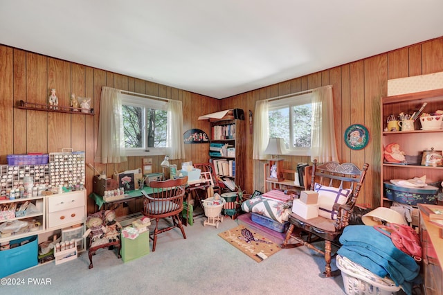 carpeted office featuring wood walls