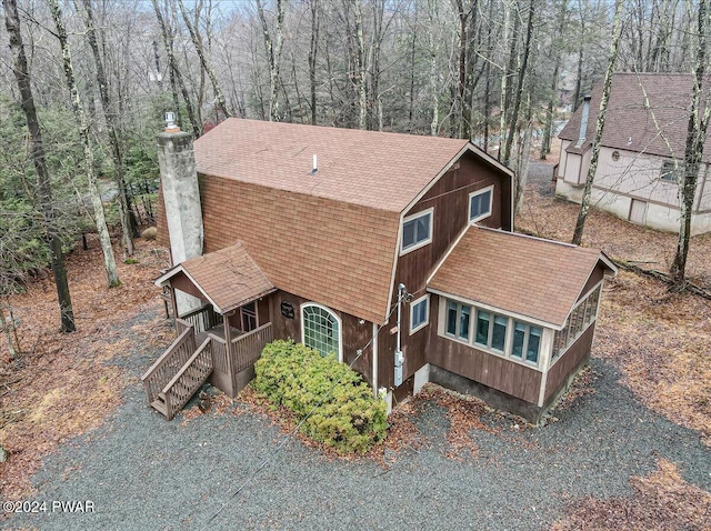 view of side of property featuring a porch