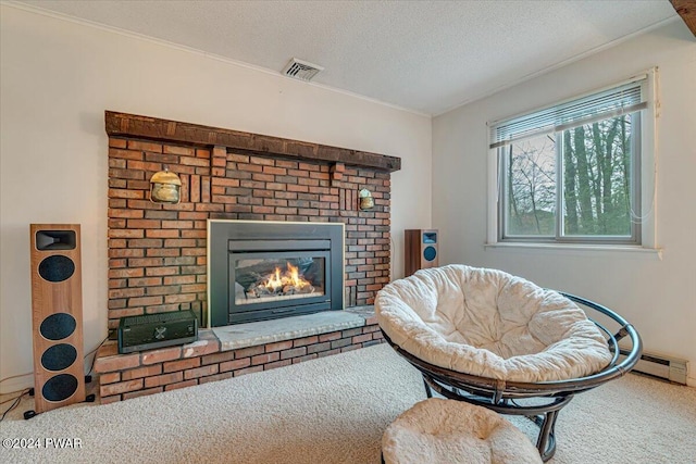 living area featuring carpet floors, a textured ceiling, and a brick fireplace