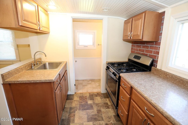 kitchen featuring stainless steel gas stove and sink