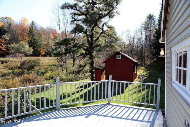 wooden terrace featuring a storage unit