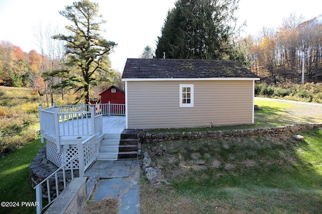 view of outdoor structure with a lawn