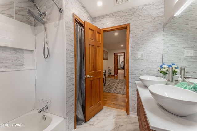 65 N Shore Dr, Albrightsville, PA 18210 - bathroom with washtub / shower combination, a sink, double vanity, visible vents, and marble finish floor