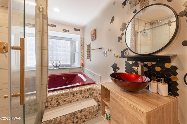65 N Shore Dr, Albrightsville, PA 18210 - bathroom featuring a tub with jets, backsplash, vanity, and tiled shower