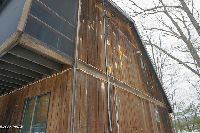 view of property exterior with a barn