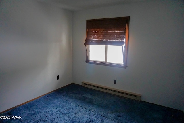 unfurnished room featuring carpet and baseboard heating