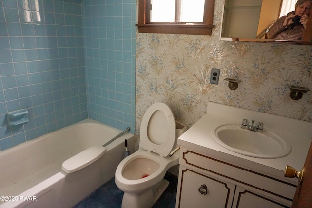 full bath featuring vanity, bathing tub / shower combination, toilet, and wallpapered walls