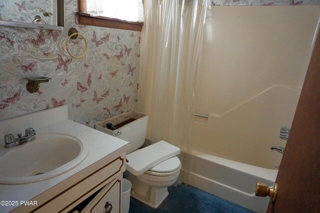 bathroom with toilet, wallpapered walls, shower / tub combo with curtain, and vanity