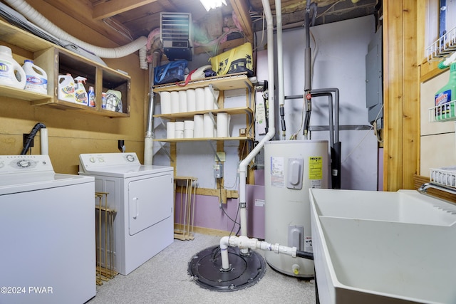 washroom with washing machine and clothes dryer, light carpet, water heater, and sink