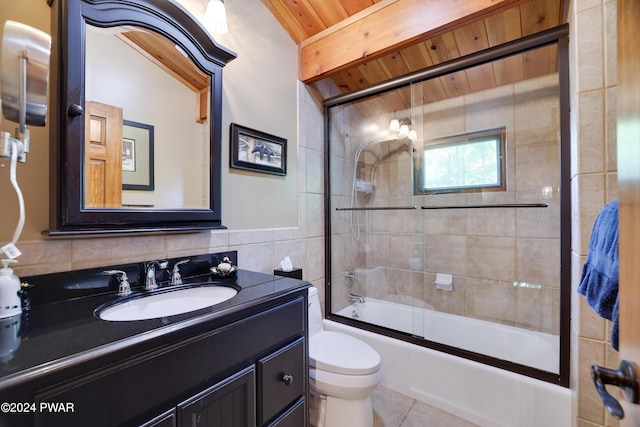 full bathroom featuring wood ceiling, vanity, shower / bath combination with glass door, tile walls, and toilet