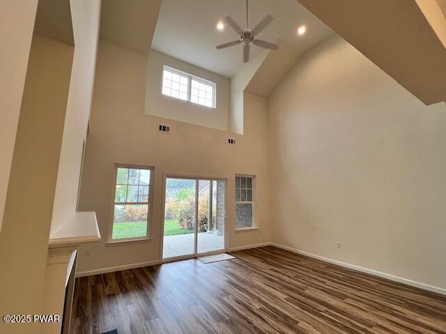 dining space featuring baseboards, wood finished floors, and crown molding