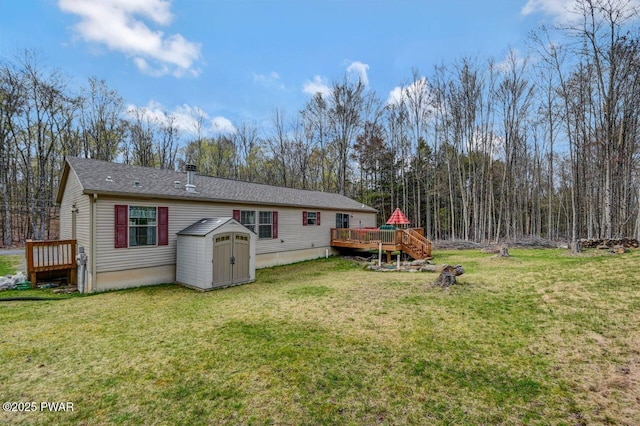 78 Orion Way, Lake Ariel, PA 18436 - rear view of property with a shed, a deck, a lawn, and roof with shingles