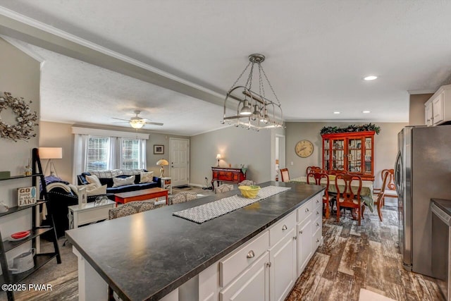78 Orion Way, Lake Ariel, PA 18436 - kitchen featuring freestanding refrigerator, open floor plan, dark countertops, white cabinetry, and dark wood-style floors
