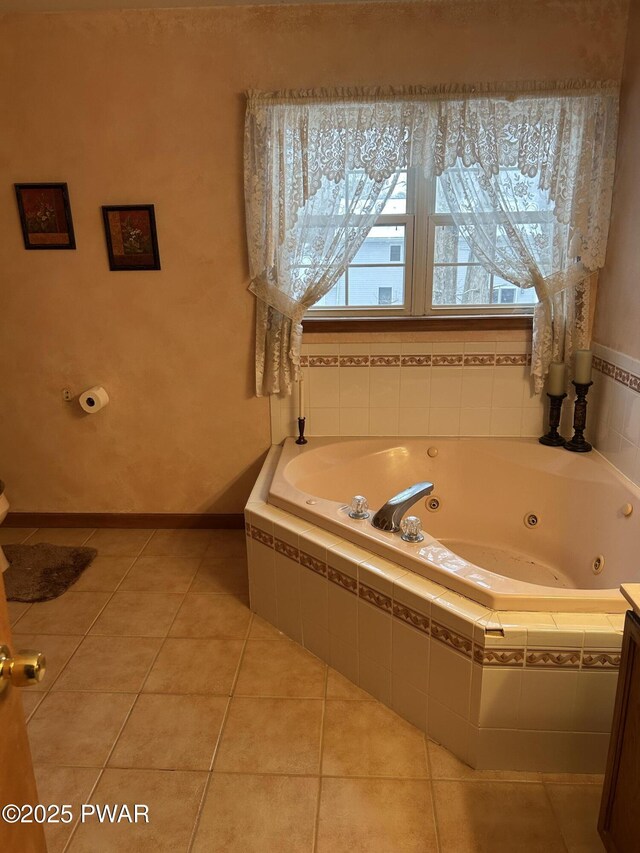 bathroom with tile patterned flooring and tiled tub