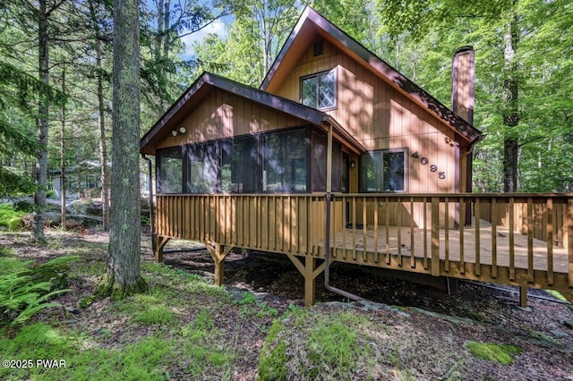 268 S Fairway Dr, Lake Ariel, PA 18436 - rear view of property featuring a sunroom, a chimney, and a wooden deck