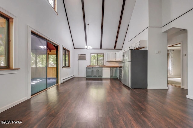 268 S Fairway Dr, Lake Ariel, PA 18436 - unfurnished living room featuring baseboard heating, high vaulted ceiling, dark wood finished floors, an AC wall unit, and beamed ceiling
