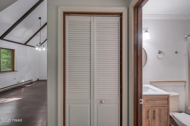 268 S Fairway Dr, Lake Ariel, PA 18436 - bathroom featuring a closet, vanity, crown molding, and a baseboard heating unit