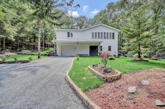 front facade featuring a front yard and a garage