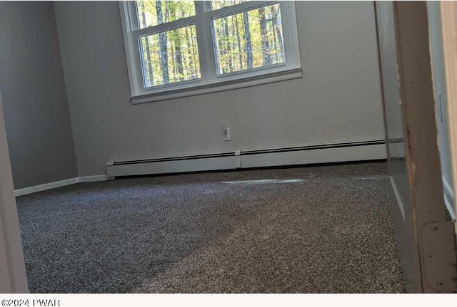 empty room with a baseboard heating unit