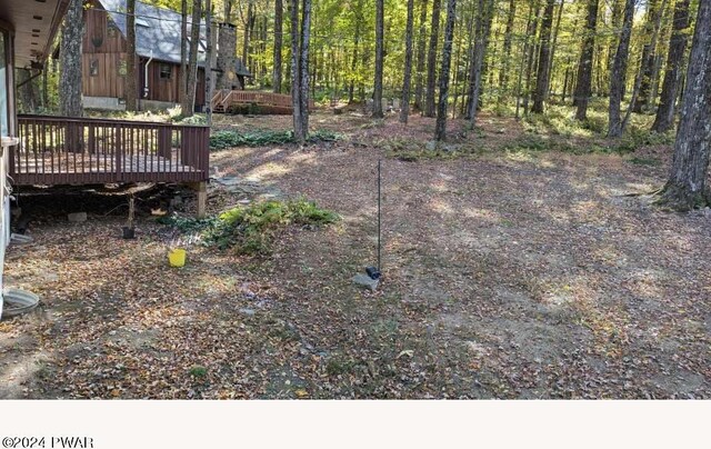 view of yard with a wooden deck