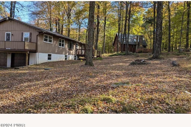 view of yard featuring a garage