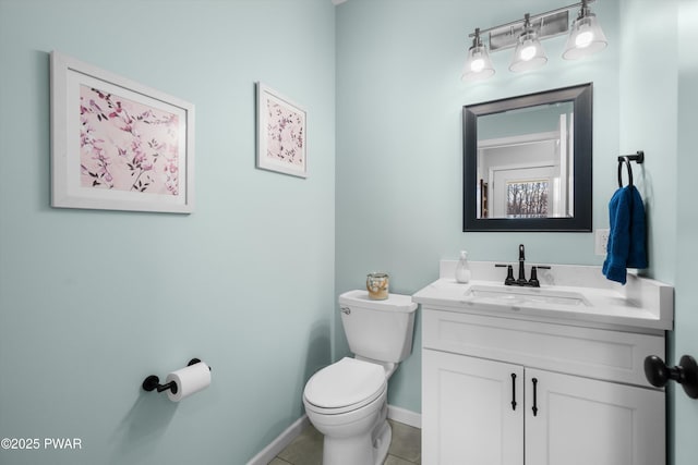 bathroom with vanity, tile patterned floors, and toilet