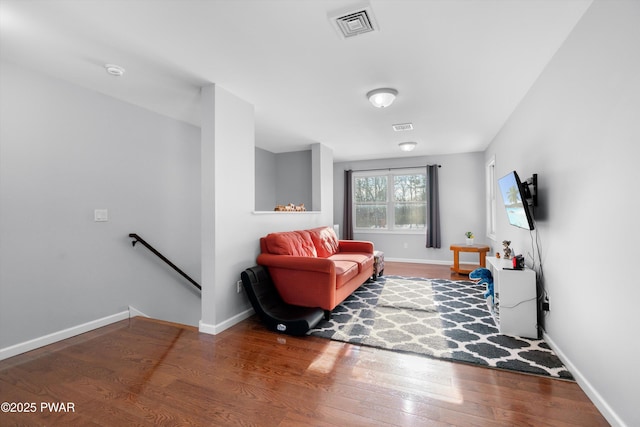 sitting room with hardwood / wood-style flooring