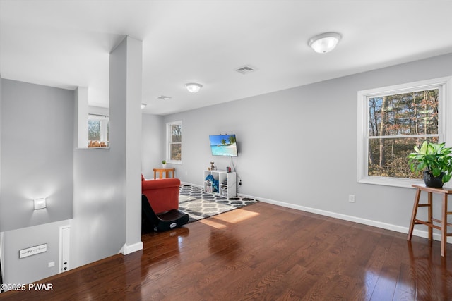 exercise area with dark hardwood / wood-style flooring