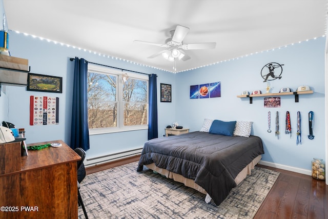 bedroom with a baseboard radiator and dark wood-type flooring