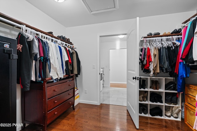 walk in closet featuring dark hardwood / wood-style floors