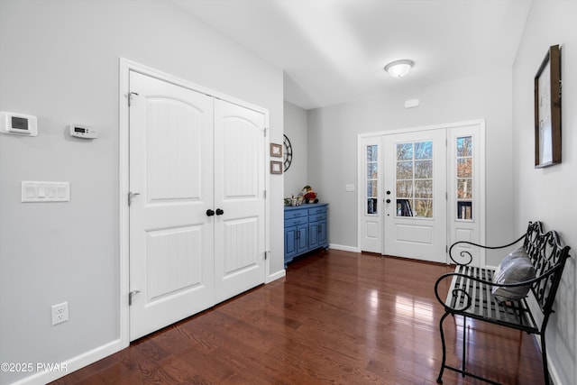 foyer with dark wood-type flooring